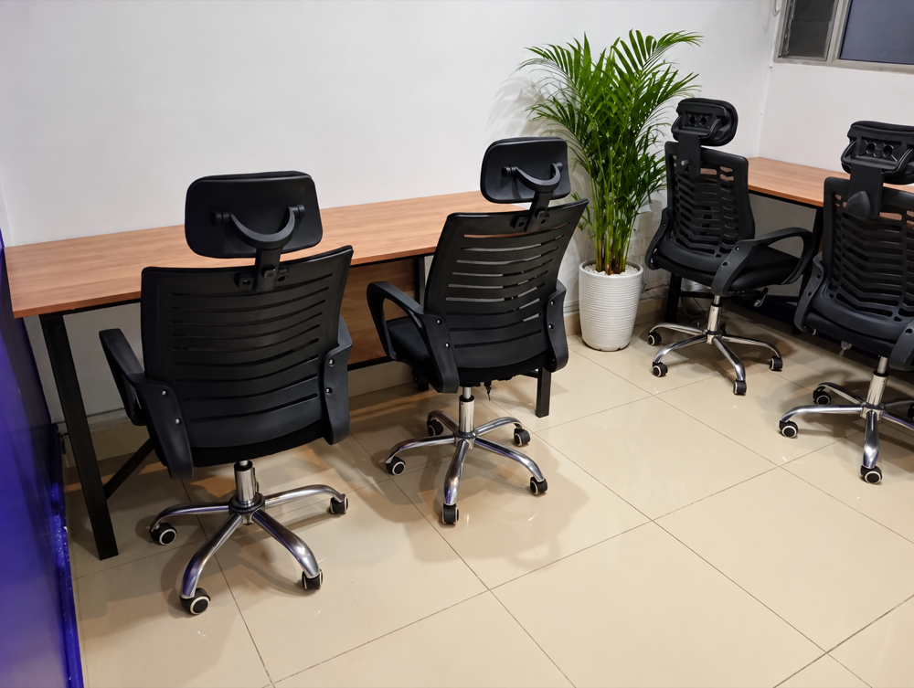 Furnished private office with four chairs and desks